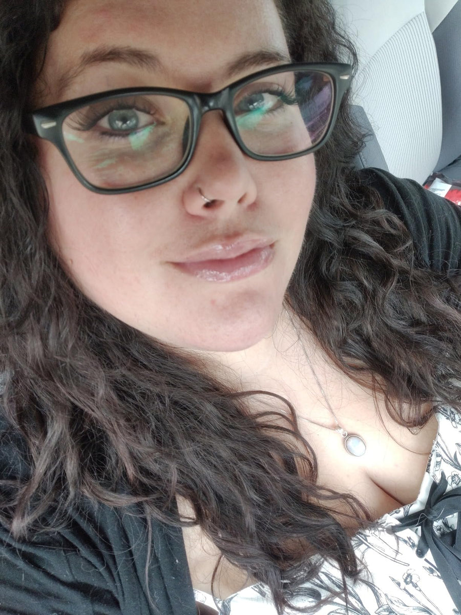 Customer using PDRN Peptide Glossy Lip Balm