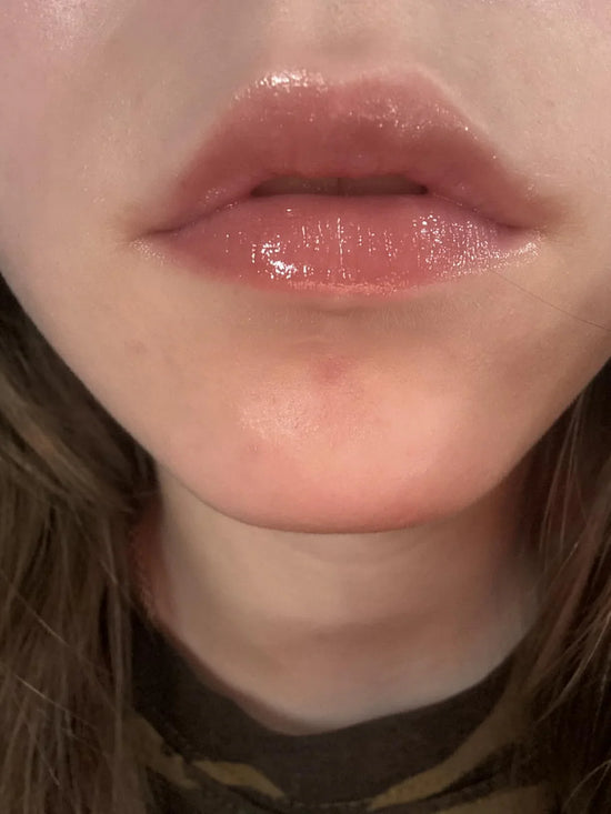 Customer using PDRN Peptide Glossy Lip Balm